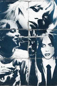 two women in front of a brick wall with black and white images on it, one holding a microphone to the other's mouth