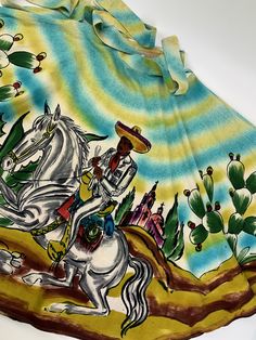 1950'S Hand Painted Mexican Skirt in a full circle with rich hand painted colors.. This skirt is longer than most at 33 inches! An artistic combination of Mexican themes with splashes of color in a boarder print. Beautiful, great colors and awesome details. The Mexican Senor on the horse is the front side of this skirt. This is made of 100% cotton. There is no maker or size label attached. I would say this is a WOMEN'S SIZE SMALL to MEDIUM.. with a 27 inch waist This waistband has hook & eye Mexican Skirt, Mexican Skirts, Full Circle Skirt, 1940s Dresses, Full Circle Skirts, Border Print, Back Women, Full Circle, Womens Skirts