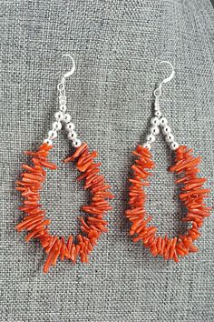 These coral and sterling silver earrings were made by Navajo silversmith Doreen Jake.Length: 2 3/4"Width: 1 1/2"Bead Sizes Vary: 1/4" to 1/2"Free shipping on all orders! We ship with USPS and always include tracking. All orders ship within a day of payment.Returns are accepted up to 30 days after you receive your order. Just send us a message. Our shop offers cash back or store credit. The item must be returned in new condition. Bead Sizes, Bear Carving, Coral Earrings, White Buffalo, Pearl Chain, Native American Jewelry, Free Jewelry, White Vintage, Sterling Silver Earrings