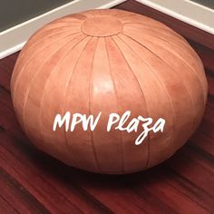 an inflatable ball sitting on the floor with words mpv plag written on it