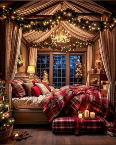 a bedroom decorated for christmas with plaid blankets and lights on the windowsills,