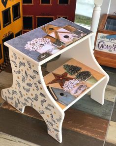 a small white table with pictures on it