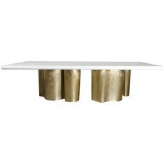 a white and gold table with two rolls on the top, against a white background