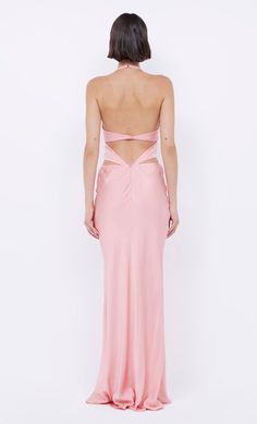 the back of a woman wearing a pink gown