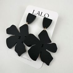 the black flower earrings are on display