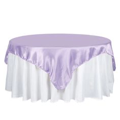 a round table covered in a purple satin