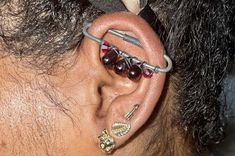 a man with some piercings on his ear