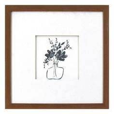 a drawing of a vase with flowers in it on a white background is framed by a brown wooden frame