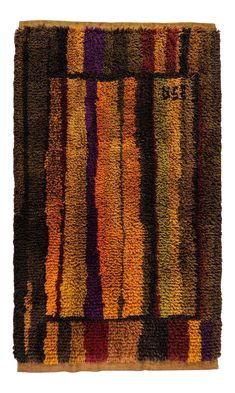 a multicolored rug with stripes on it