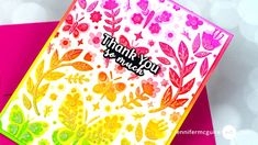 a card with the words thank you on it and flowers in pink, green, yellow and orange