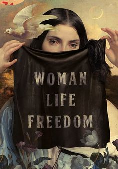 a woman holding up a banner with the words woman life and freedom written on it