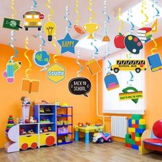 a child's room with toys and decorations on the ceiling