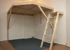 a loft bed made out of wood with a ladder on the bottom and carpeted floor