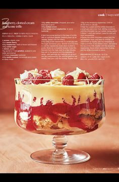 an image of a dessert with berries and cream in it's dish on a table