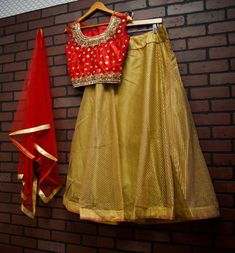 *Net Dupatta with gold border *Skirt with Full Gold Embroidery *Gold Beading on Blouse *Readymade Lehenga Choli/Crop Top Set *Size: Blouse Bust: 40 inches (+ 2 inch margin) Waist: 36 inches (+2 inch margin) Skirt length: 41 inches Skirt waist: 37 inches *Color May Vary Slightly From Picture *Our store is located in Los Angeles Semi-stitched Sets With Gold Embroidery And Traditional Drape, Traditional Skirt With Resham Embroidery For Reception, Gold Semi-stitched Kundan Lehenga, Festive Skirt With Resham Embroidery For Reception, Gold Embroidered Sharara In Chinon, Gold Sharara With Gold Embroidery In Chinon, Gold Embroidered Chinon Sharara, Anarkali Skirt With Resham Embroidery, Chanderi Sets With Gold Embroidery For Navratri