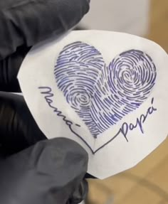 someone holding up a paper with a fingerprint on it that says i love papa