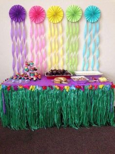 the table is decorated with colorful paper fan decorations