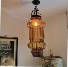 a chandelier hanging from the ceiling in a room