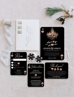 black and gold wedding stationery suite with chandelier on the front, pocketfolds, and matching cards