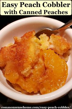 a white bowl filled with peach cobbler and topped with a spoon