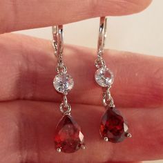 Ruby Dangle Earrings, Red Silver Earrings, Ruby Earrings Silver, Red Crystal Earrings, Pretty Earrings Aesthetic, Red Drop Jewelry With Matching Earrings, Red Pear-shaped Earrings For Gift, Red Hypoallergenic Jewelry For Formal Occasions, Hypoallergenic Red Jewelry For Formal Occasions