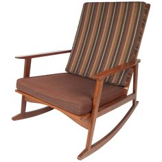 a wooden rocking chair with striped fabric on the back and seat cushion, viewed from the front