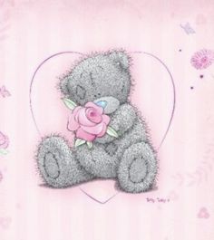 a teddy bear with a pink rose in its mouth sitting on a heart shaped card