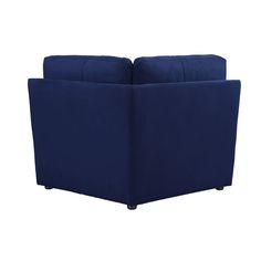 a blue couch sitting on top of a white floor