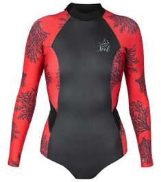 a woman wearing a red and black wetsuit with coral print on the chest,