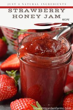 strawberry honey jam in a jar with strawberries around it and text overlay reading just natural ingredients strawberry honey jam recipe