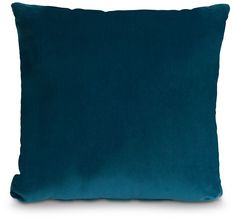 a teal blue pillow on a white background