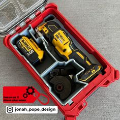 a red tool box filled with tools on top of a table