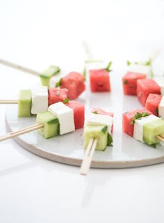 watermelon and cucumber skewers on a plate