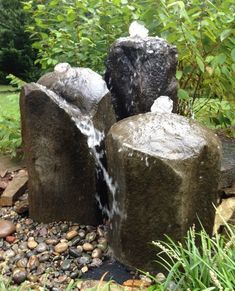 two rocks with water coming out of them