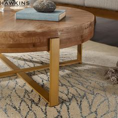 a wooden table sitting on top of a rug