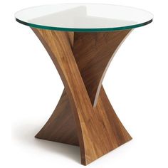 a glass and wood table with an unusual design on the top that is shaped like a cross