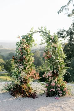 multicolored-flower-arch Floral Arch Wedding Outdoor, Garden Wedding Arch, Wedding Ceremony Floral Arch, Whimsical Garden Wedding, Floral Arch Wedding, Sophisticated Decor, Floral Installations, Wedding Arches, Arch Wedding