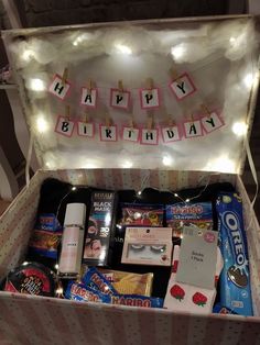 a birthday gift box filled with lots of goodies