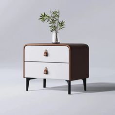 a white and brown dresser with a plant on top