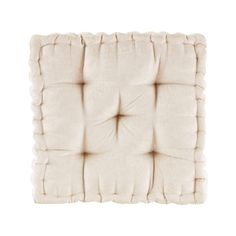 a white square cushion on a white background