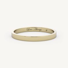 a yellow gold wedding band with the words give hope engraved on it's side