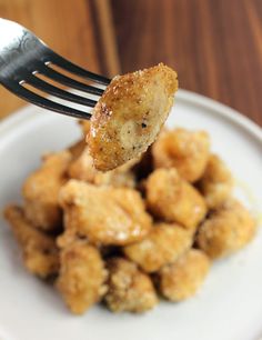 a fork with some fried food on it