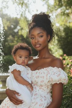 a woman holding a baby in her arms