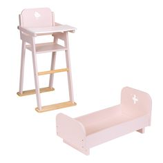 a wooden doll's high chair and bed with a white cross on the side