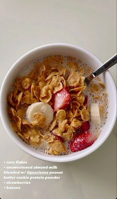 a bowl of cereal with yogurt and strawberries