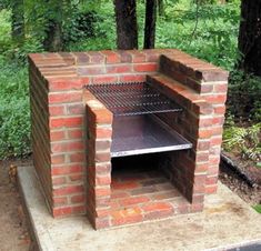 an outdoor brick pizza oven sitting on top of a cement slab