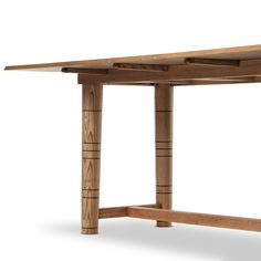 a wooden table with two legs and one leg extended to the side, on an isolated white background