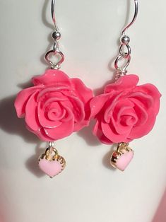 These bright pink rose earrings are very cheerful! 18mm pink polyresin rose beads accented with a light pink 8mm heart charm dangle. All hand wire wrapped in silver plated wire. 1 7/8 inches long. Be Pretty in Pink San Rafael California, Pink Rose Earrings, Light Pink Heart, Rose Beads, Pink Heart Earrings, Tree Of Life Earrings, Mini Light, Hot Pink Roses, San Rafael