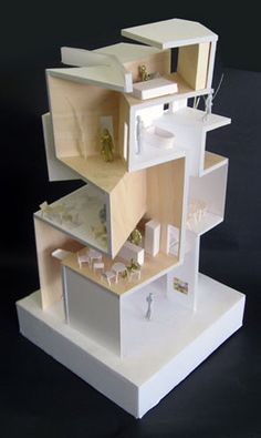 a model of a house made out of cardboard