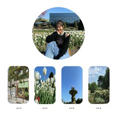 a woman sitting on the ground in front of some flowers and trees with buildings behind her